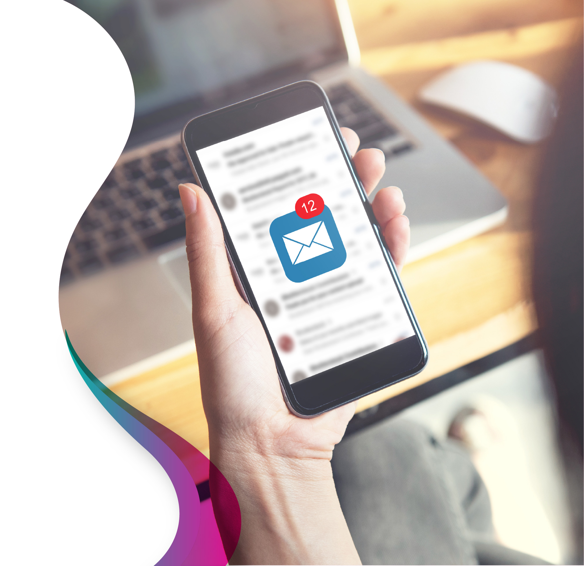 Person holding smartphone with email newsletters visible in inbox and new message notification badge